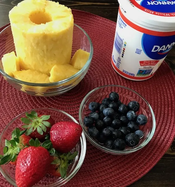 Fresh pineapple, strawberries, and blueberries are the perfect accompaniment to your favorite yogurt.