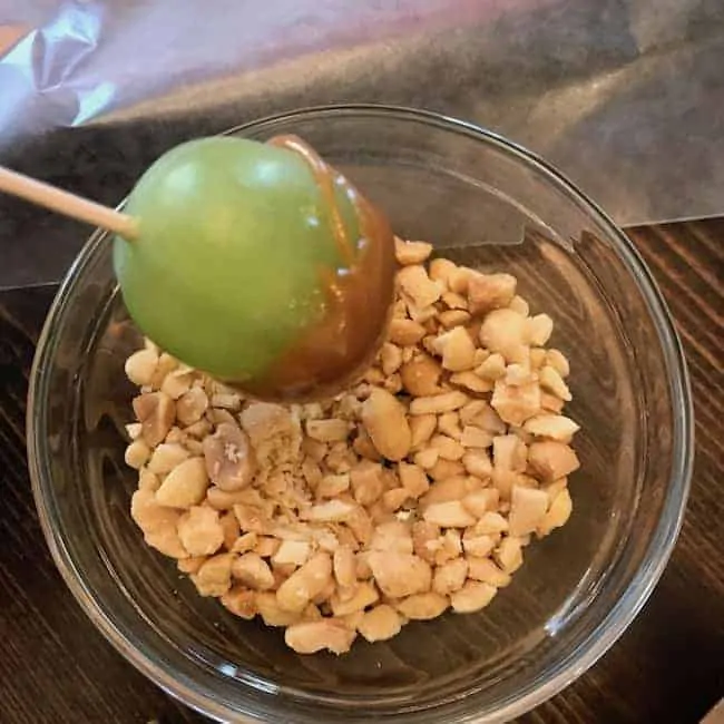 Caramel coated grape dipped in nuts