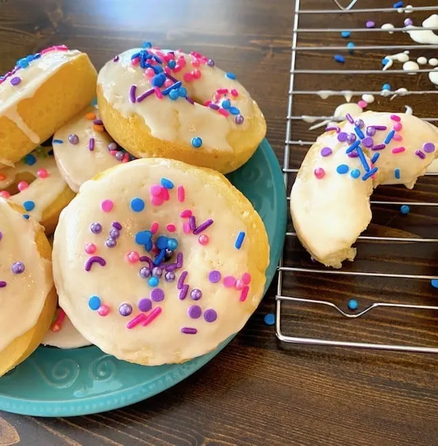 Plate of frosted and sprinkled cake mix donuts