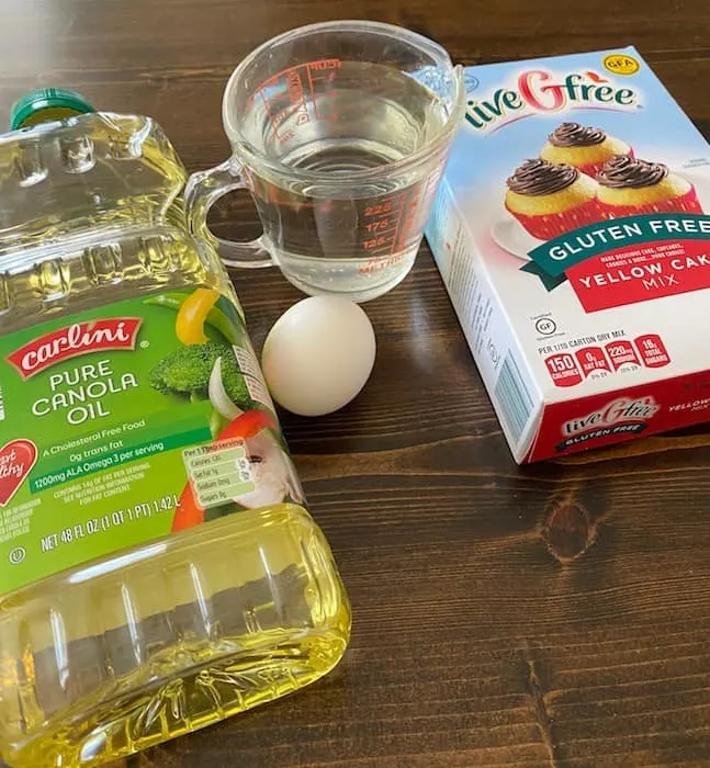 Cake mix, cup of water, egg, and cooking oil