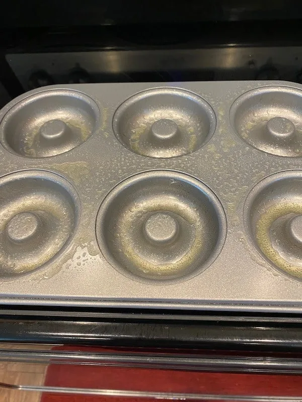 Donut pan coated with nonstick cooking spray