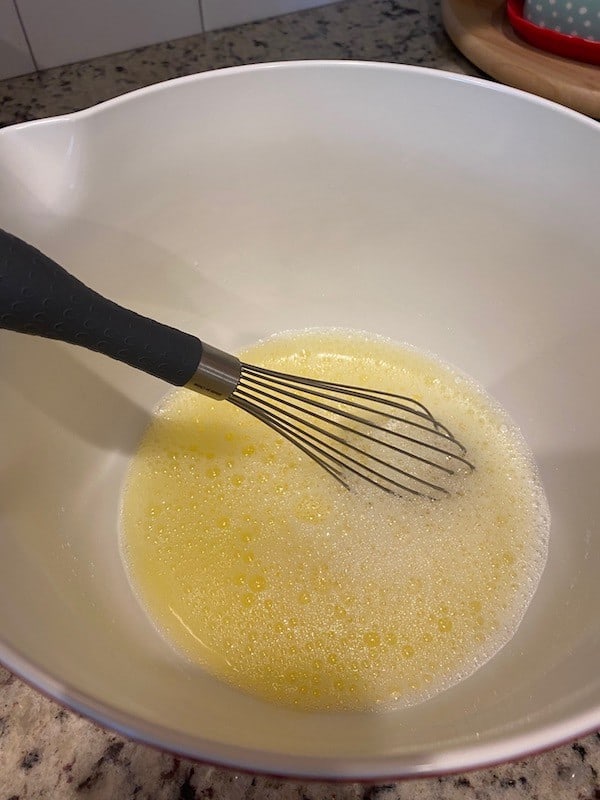 Whisked eggs, water, and oil