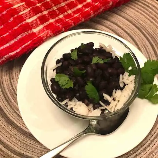 Black beans on rice with cilantro on top