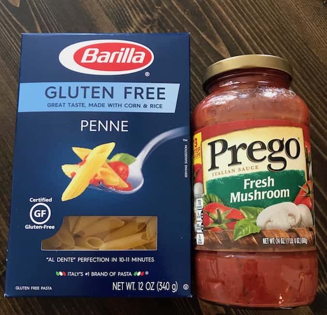 Box of penne and jar of red sauce