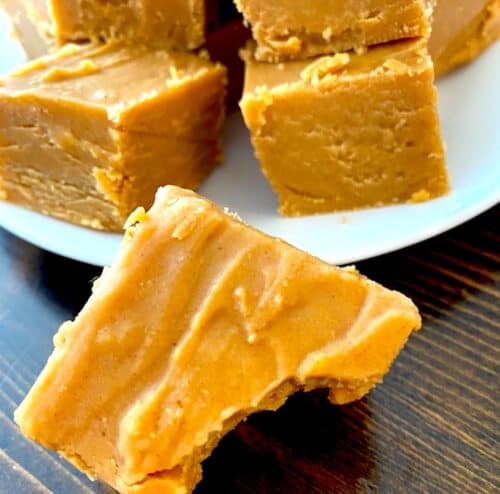 Piece of peanut butter fudge with a bite taken out of it