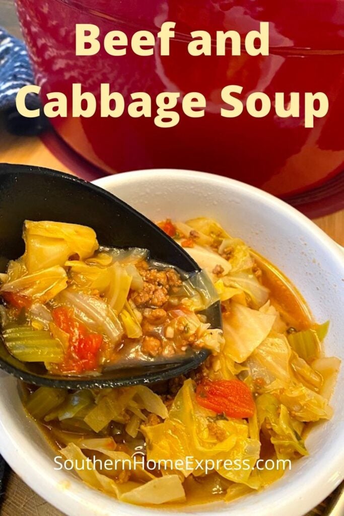 scooping beef and cabbage soup from a bowl