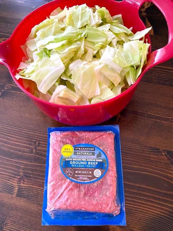 bowl of cut cabbage and pack of ground beef