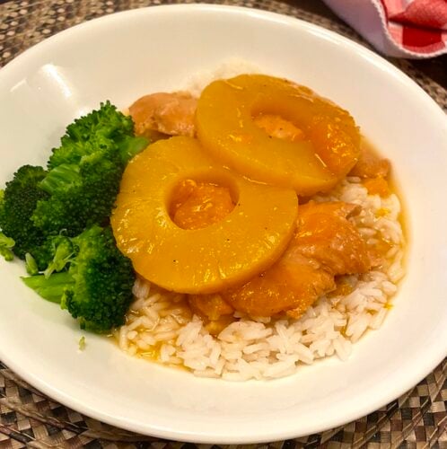 Hawaiian chicken on a plate with broccoli
