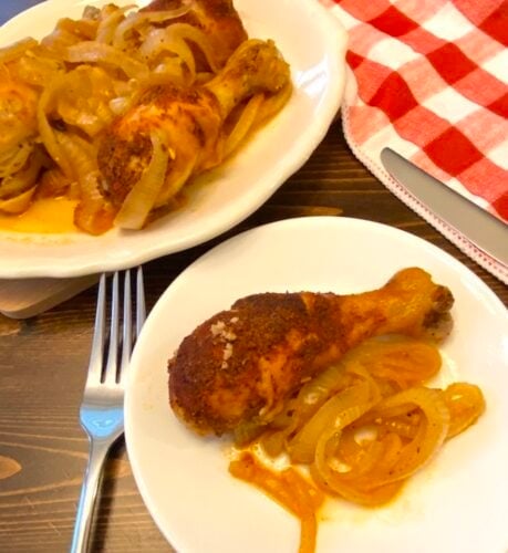 plate of crock pot garlic chicken and onions