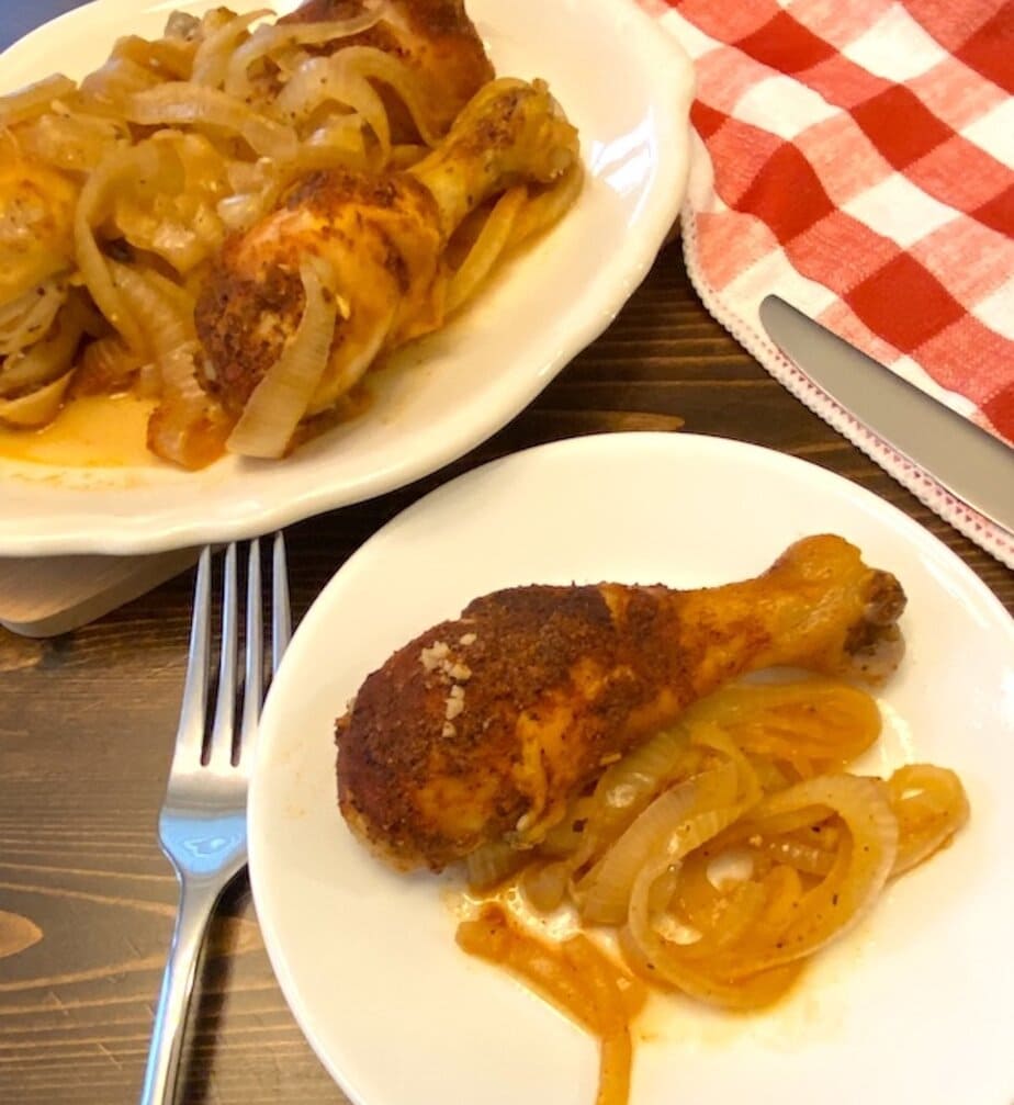 plate of crock pot garlic chicken and onions