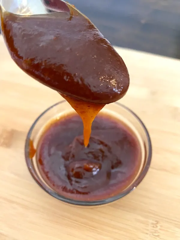 bowl and spoon of barbecue sauce