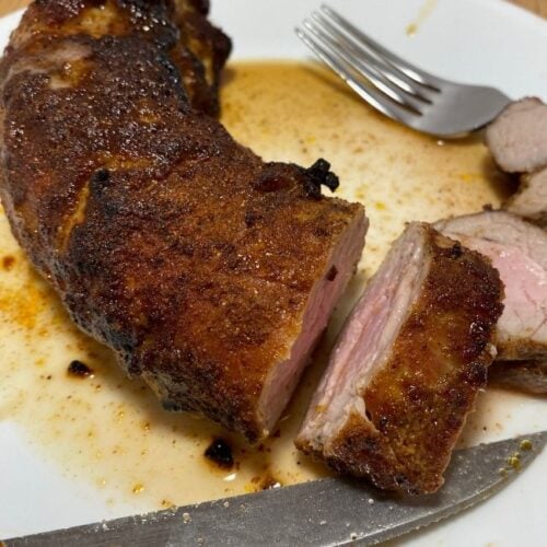 slicing an air fryer pork tenderloin