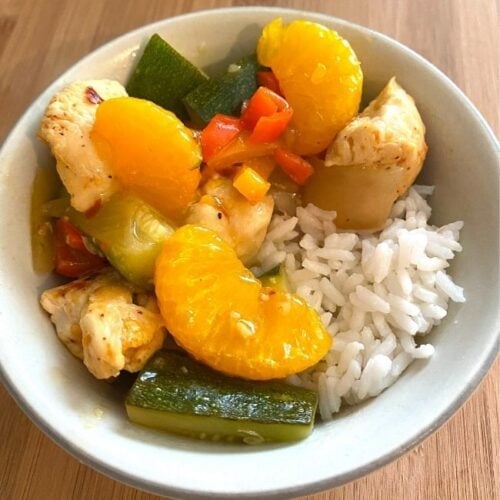 bowl of mandarin orange ginger chicken and rice