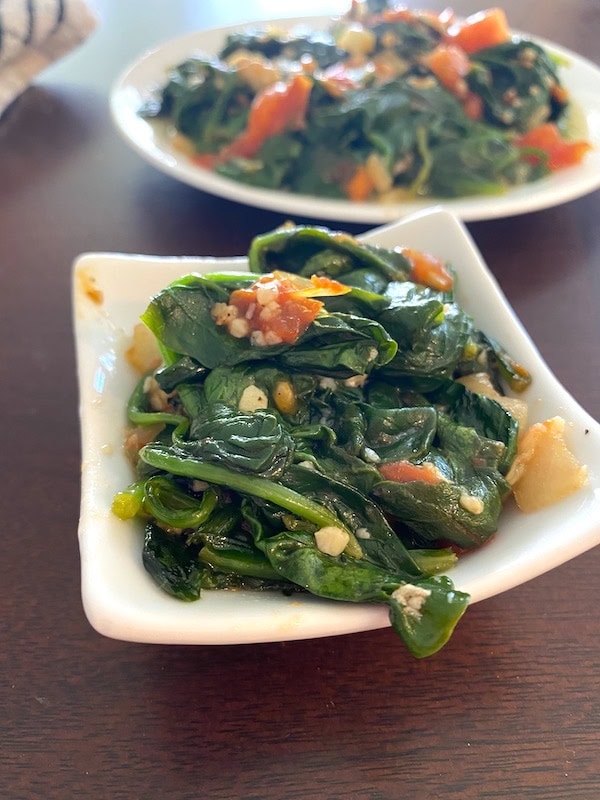 serving of spinach and tomatoes