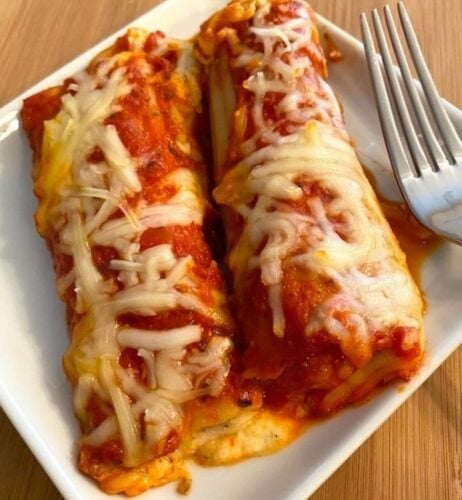 cheesy stuffed manicotti on a plate