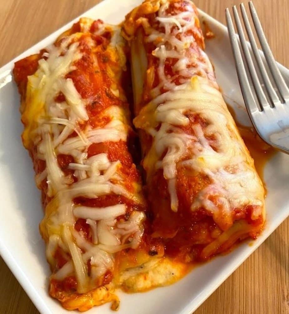 cheesy stuffed manicotti on a plate