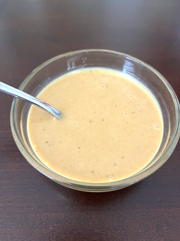 bowl of copycat Chick Fil A sauce with a spoon