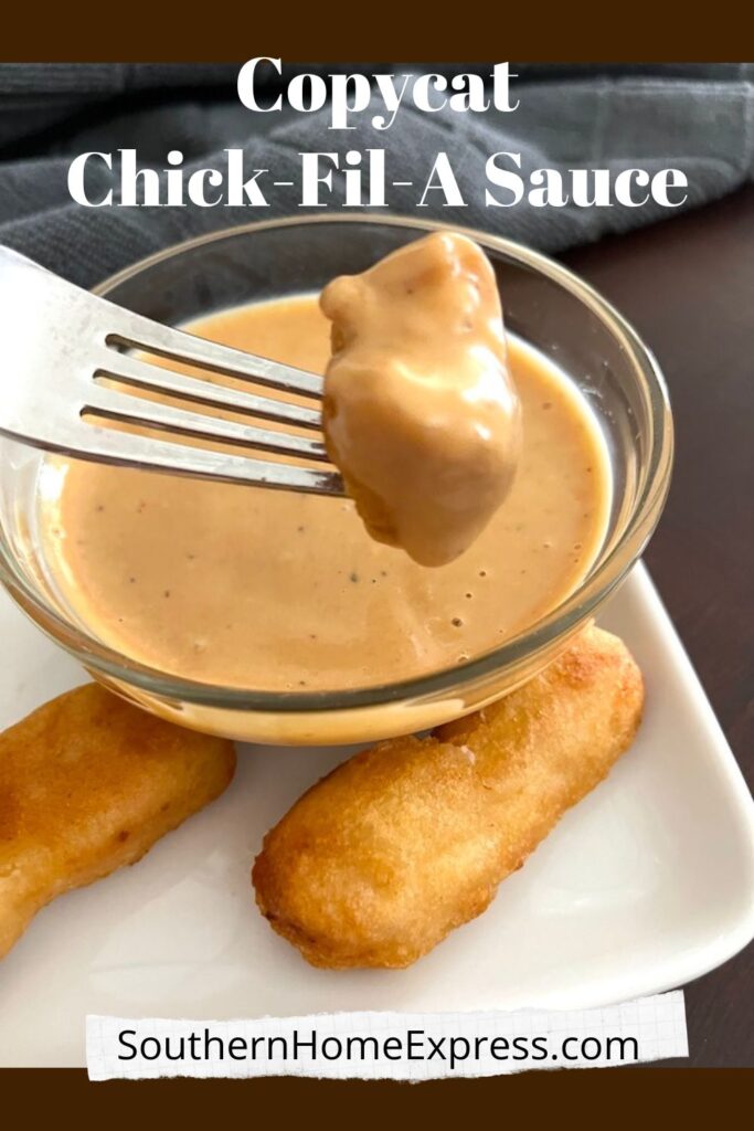 Fork of chicken dipped in Chick Fil A sauce