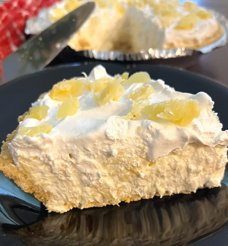 slice of pineapple pie on a black plate