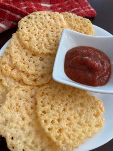 plate of cheese crisps with side of marinara sauce