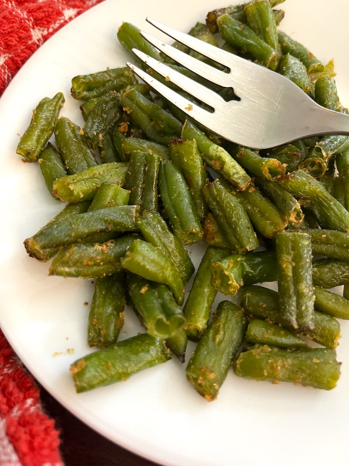 plate of green beans and a fork