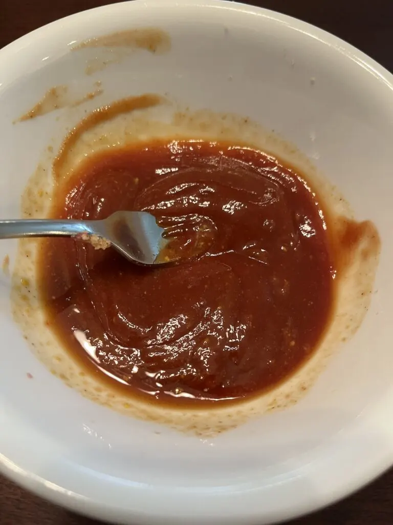 stirred meatloaf topping ingredients in a bowl