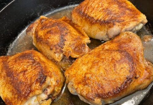 baked chicken in an iron skillet