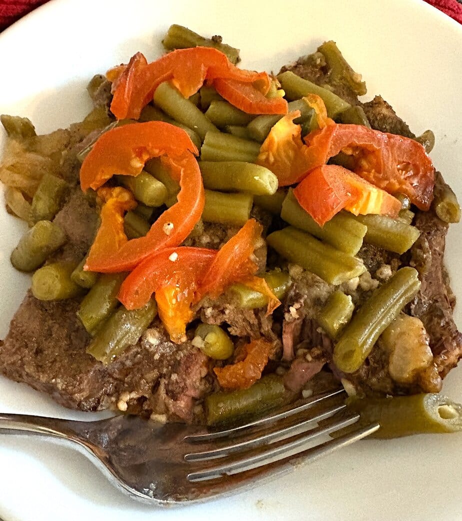 bowl of tender slow cooker chuck steak and vegetables