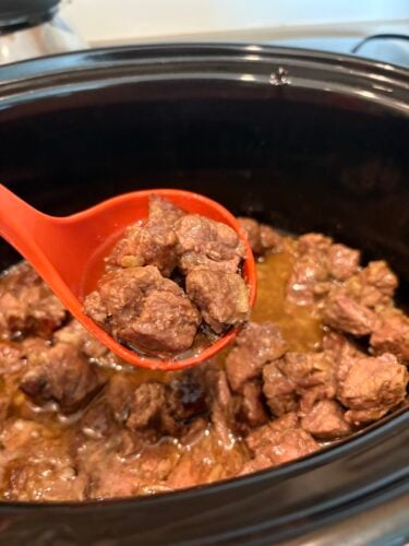 ladle in pot of butter beef