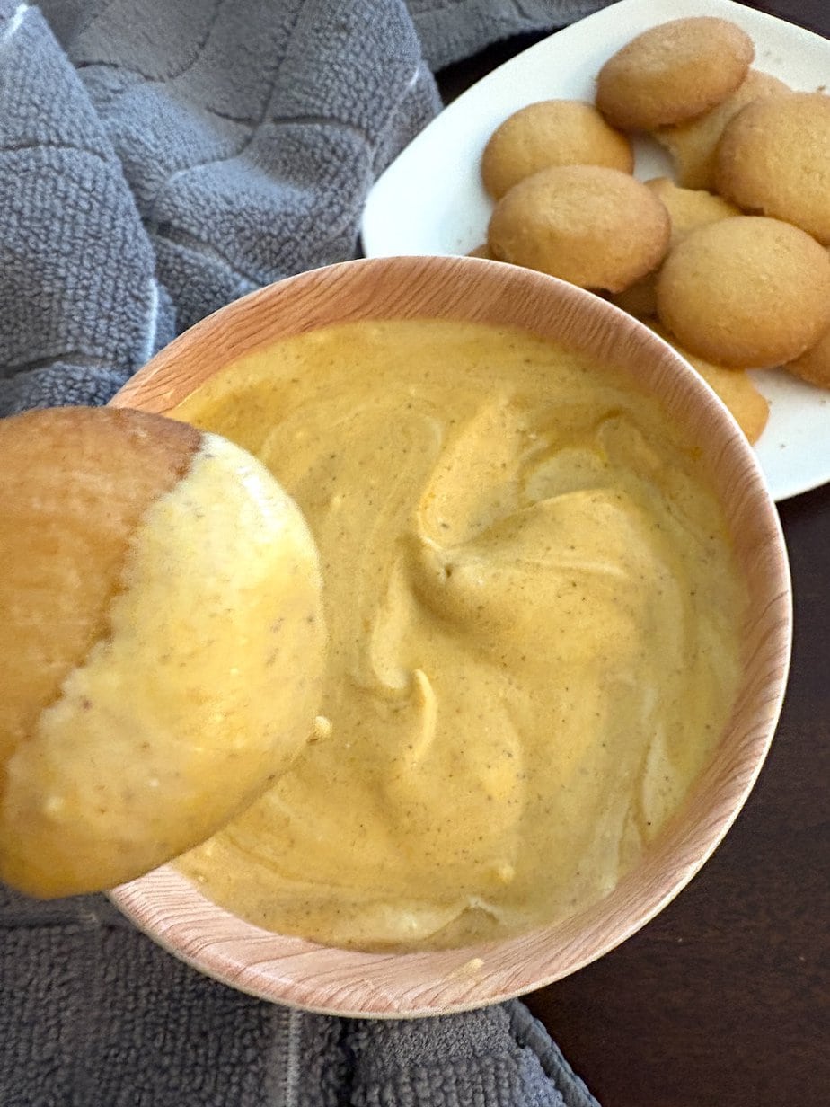 whipped pumpkin dip in a bowl with vanilla wafers