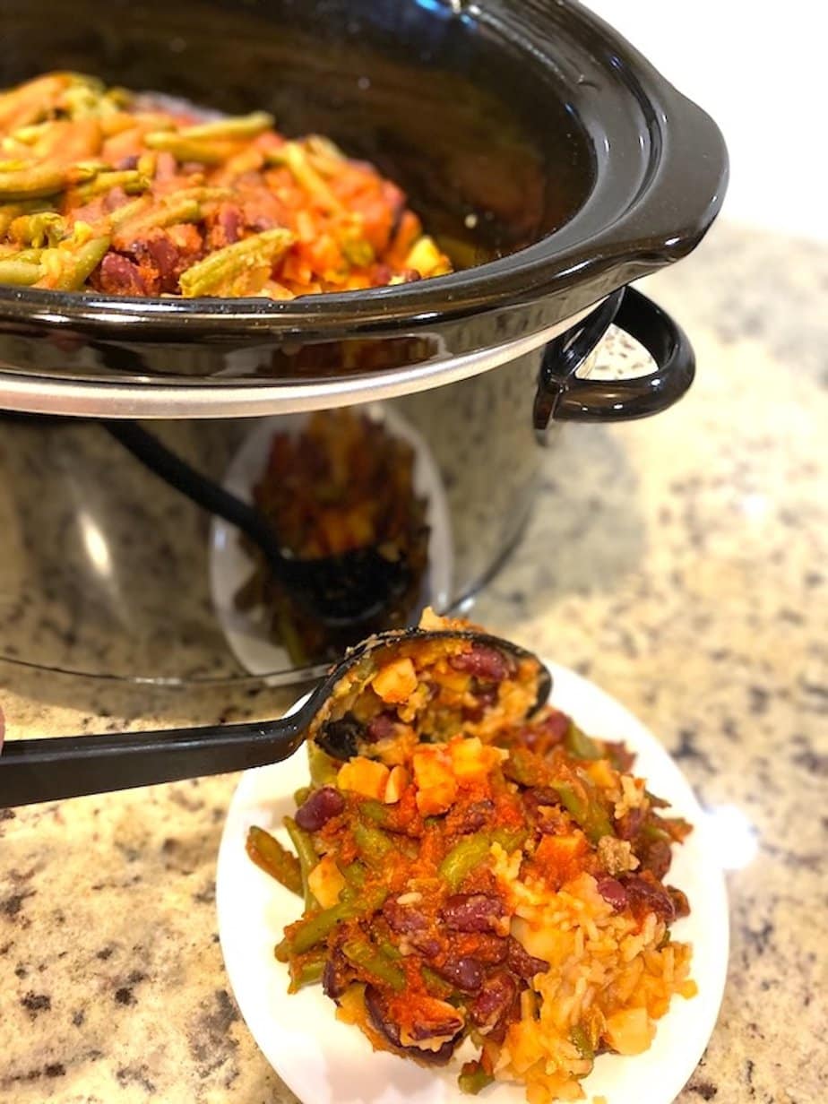 one-pot layered hamburger casserole in a slow cooker and on a plate