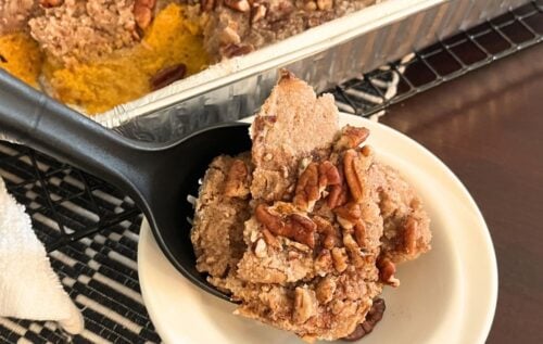 pan and plate of pumpkin pecan cobbler