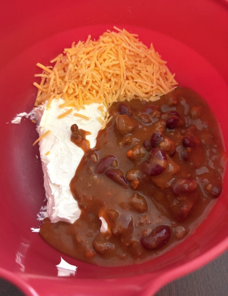 chili cheese dip ingredients in a bowl