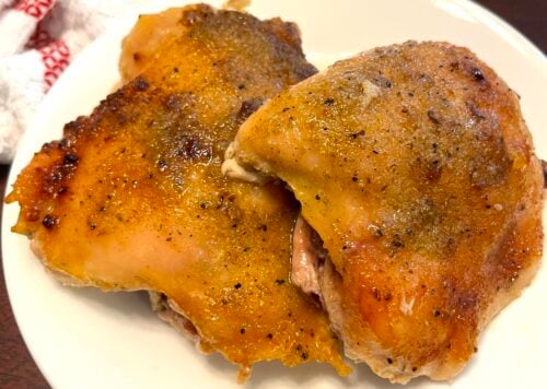 slow cooked chicken thighs on a plate
