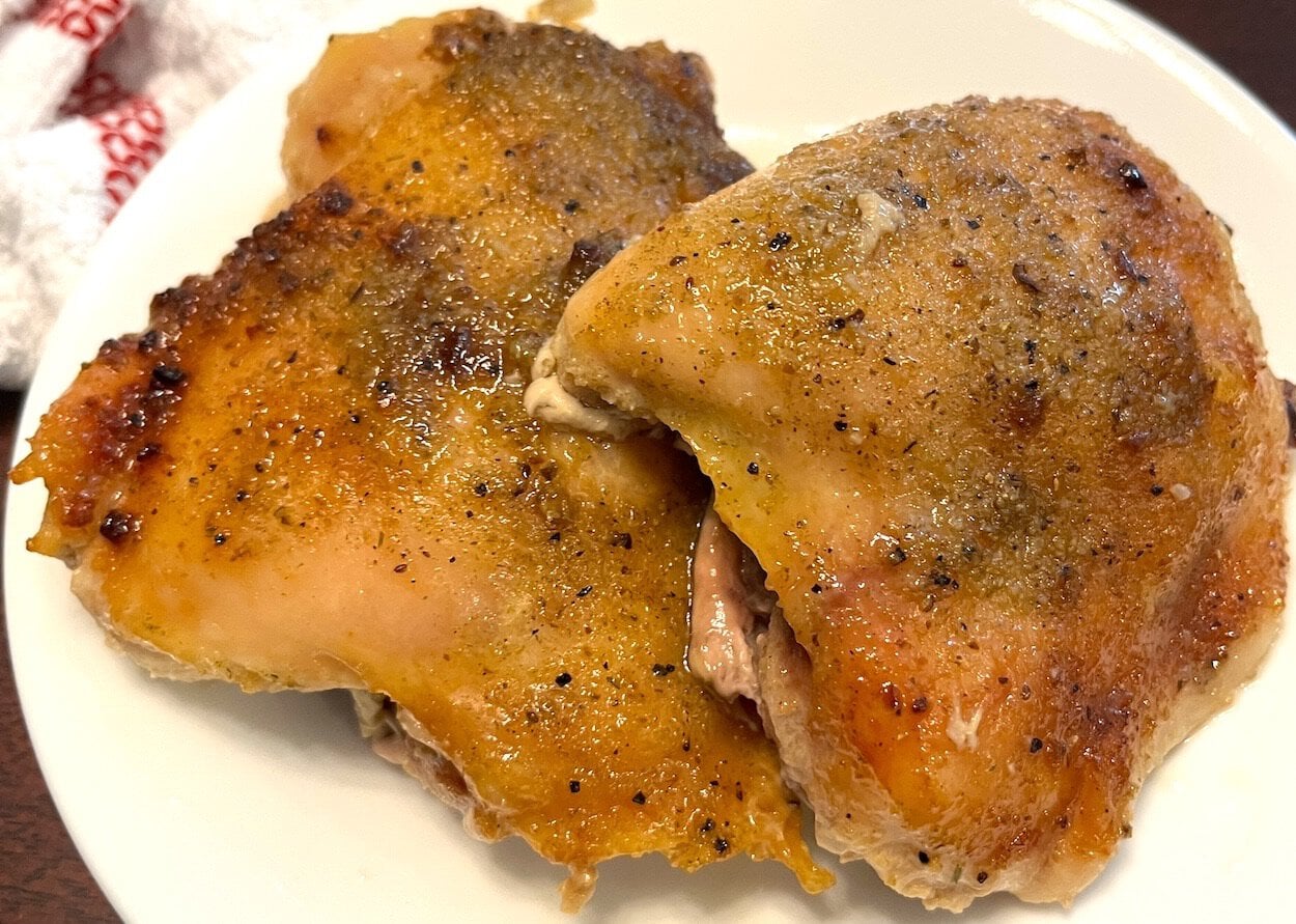 slow cooked chicken thighs on a plate