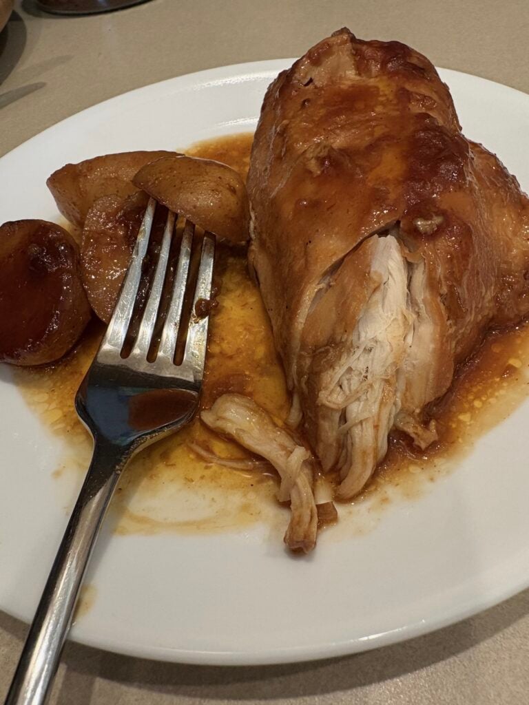 plate of barbecue chicken and potatoes