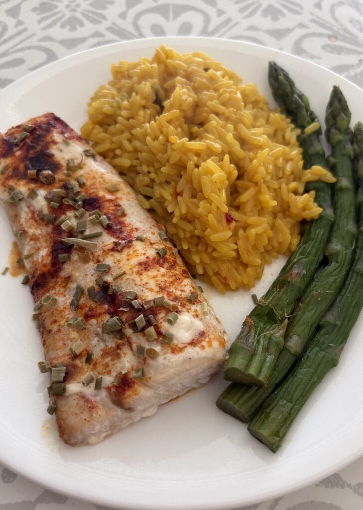 baked ranch fish, yellow rice, and asparagus