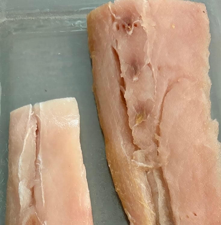 raw fish in pan
